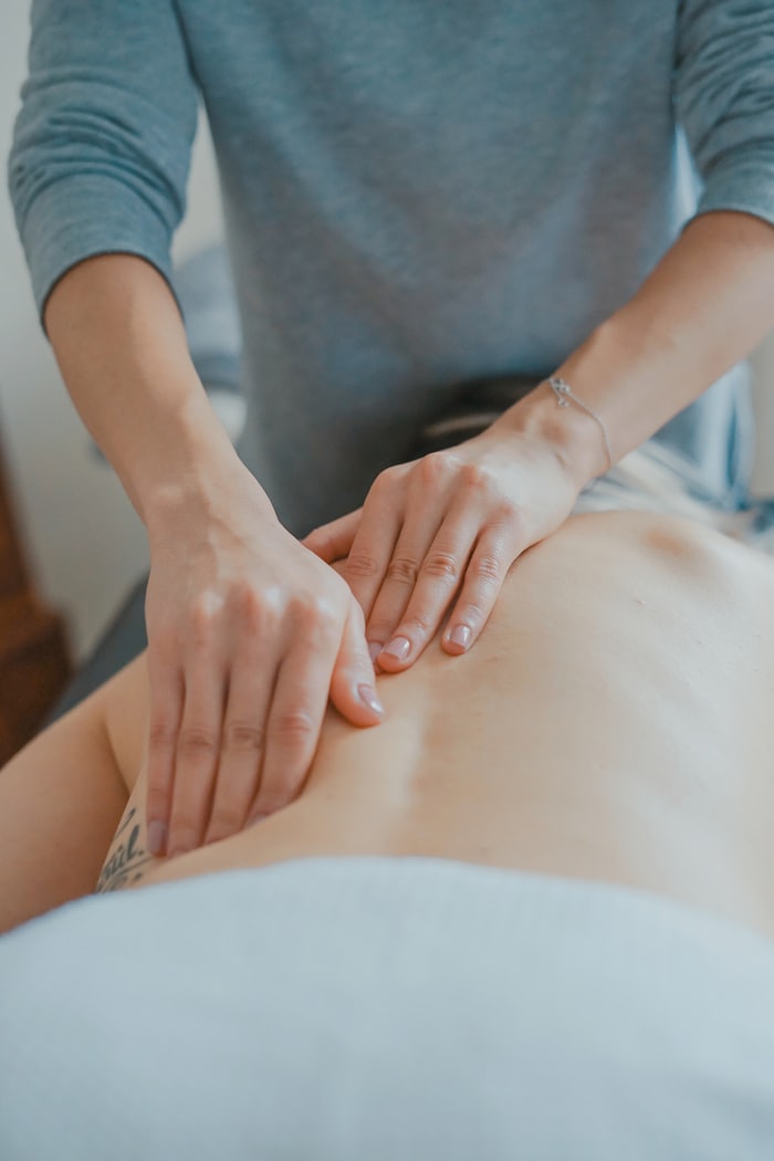 A physiotherapist treating a patient