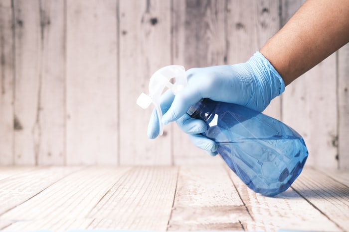 A pest control technician treating a property